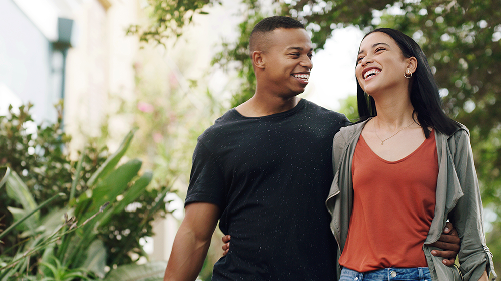 Young couple walking in a park.