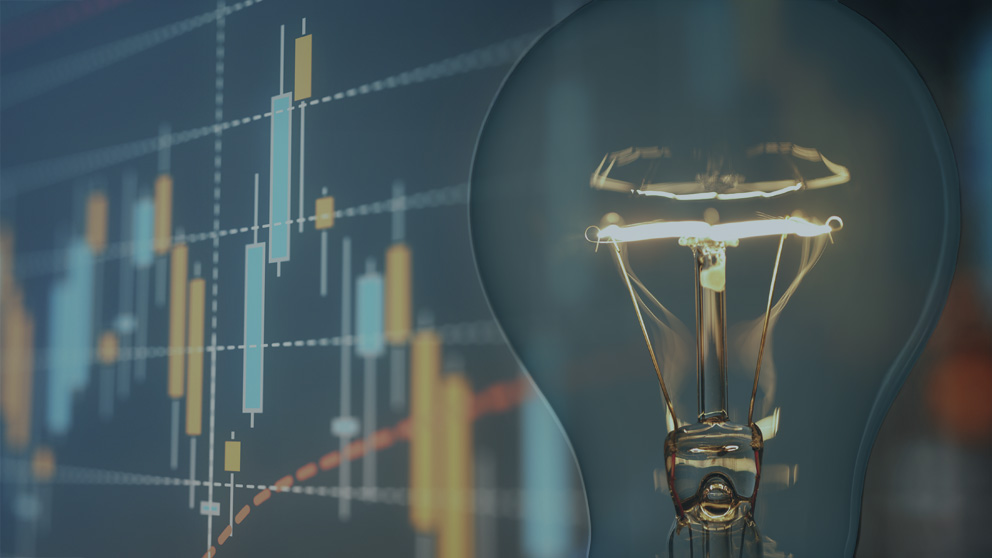 light bulb layered over investment chart