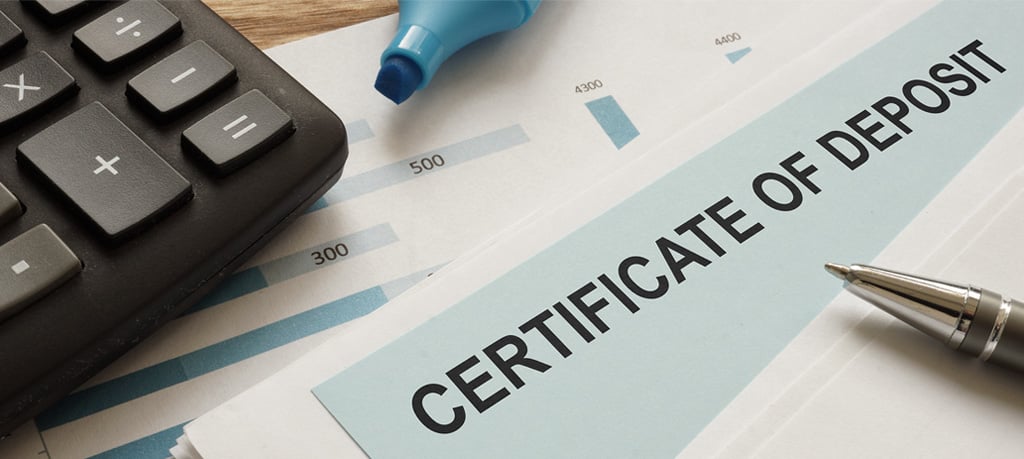CD rates comparison chart on Certificate of Deposit document with calculator for calculating interest earnings.