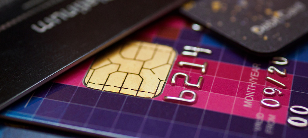 A close-up of a credit card showing a gold chip, partial account number 6214, and an expiration date of September 2020.