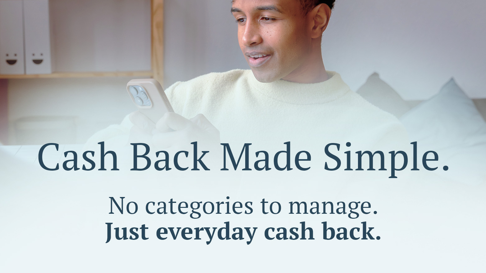 Man with mobile phone. Text: "Cash back made simple. No categories to manage. Just everyday cash back.""