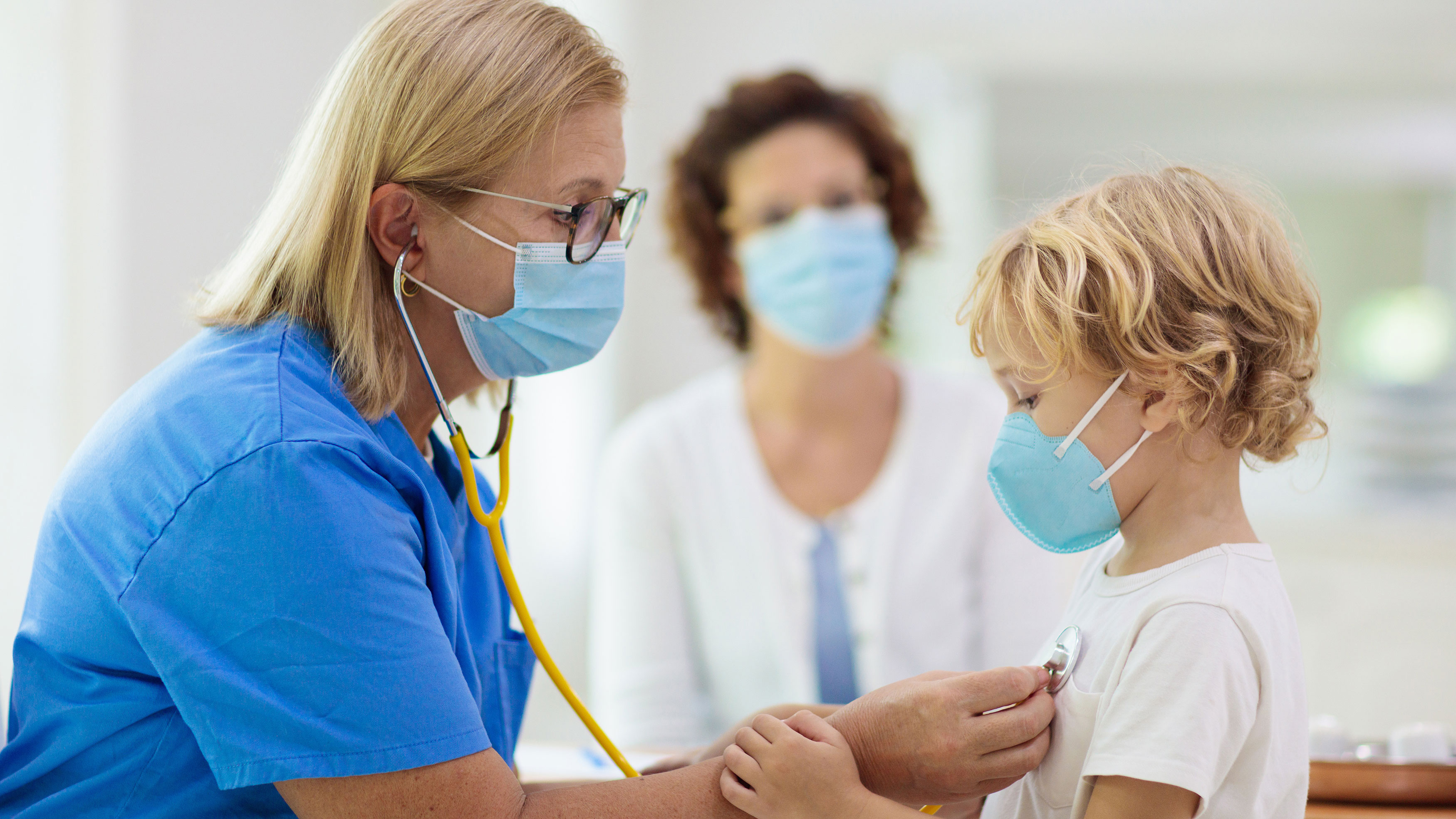 pediatrician and child with mother