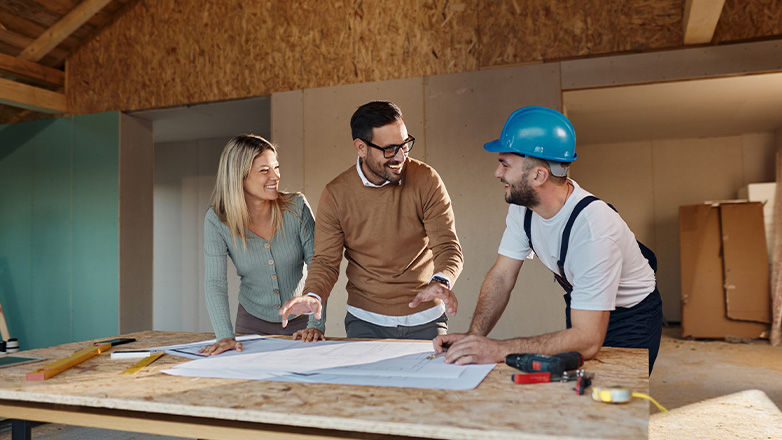 Young couple working with builder