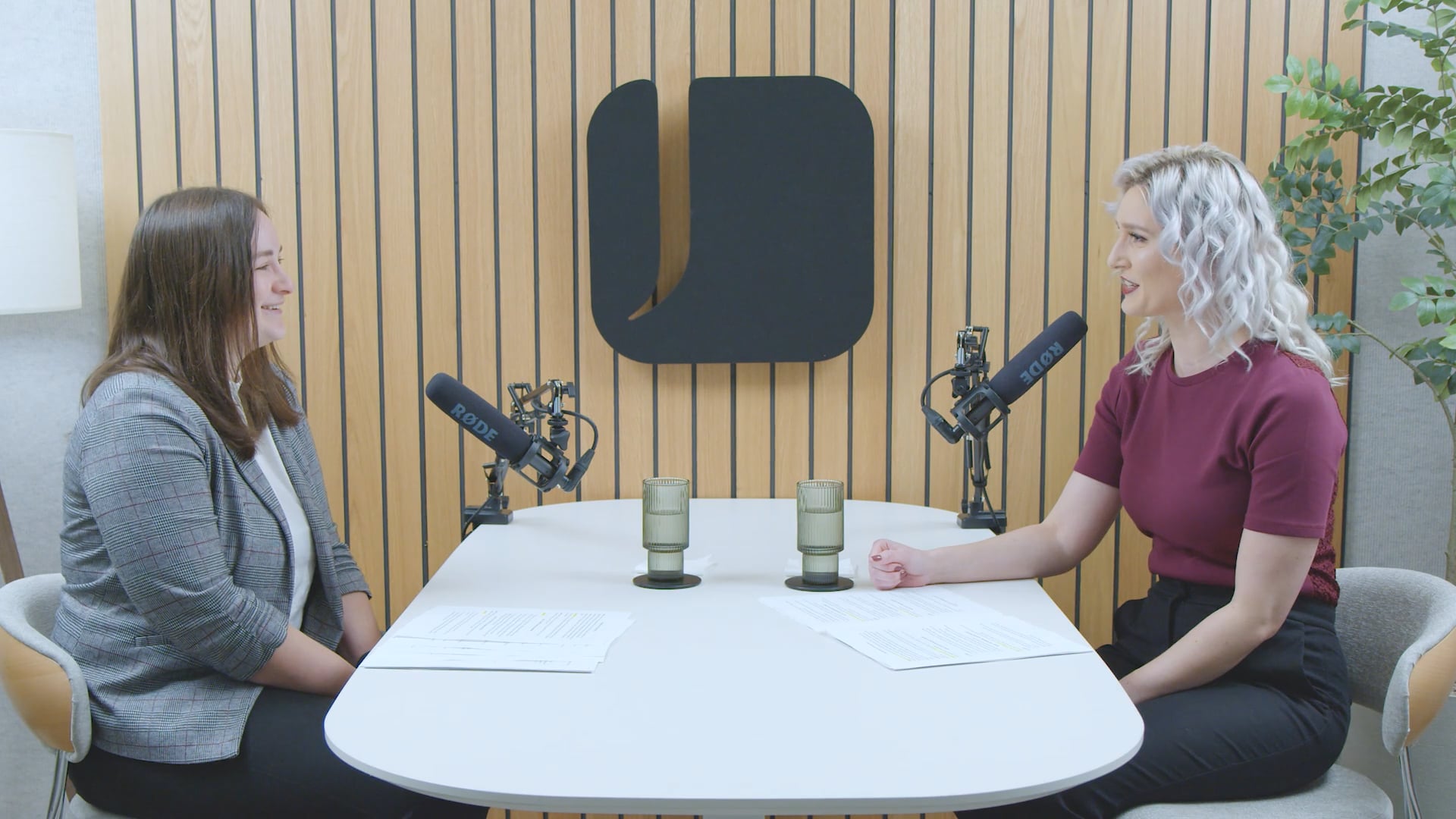 Allison Moeschberger and Sam Kolb in a podcast studio.
