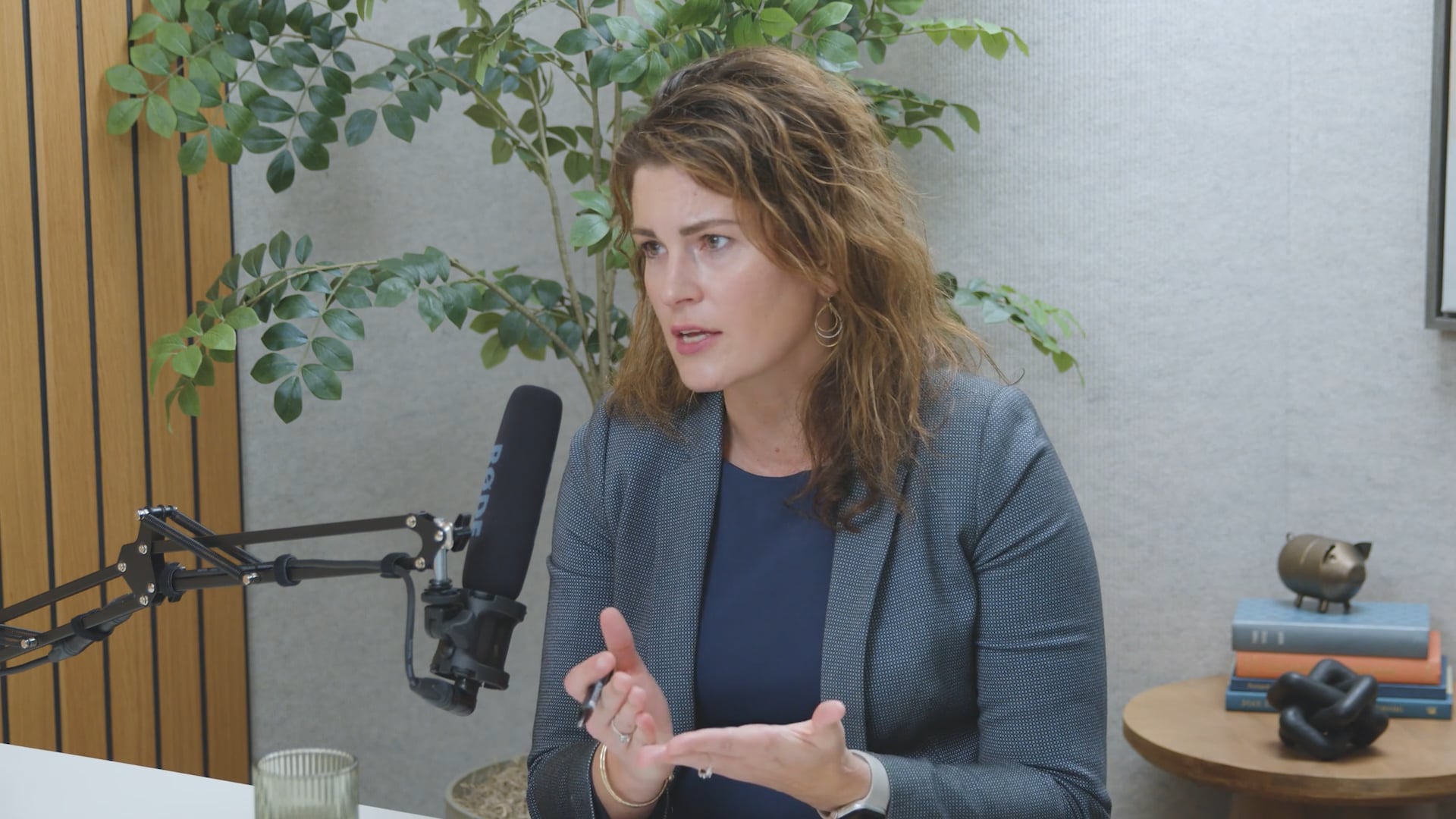 Maureen Holsen speaking during a podcast or recorded interview in an office setting.