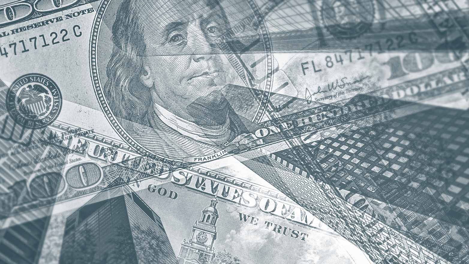Double exposure image of US hundred dollar bills overlaid with digital financial market data screens and trading charts.