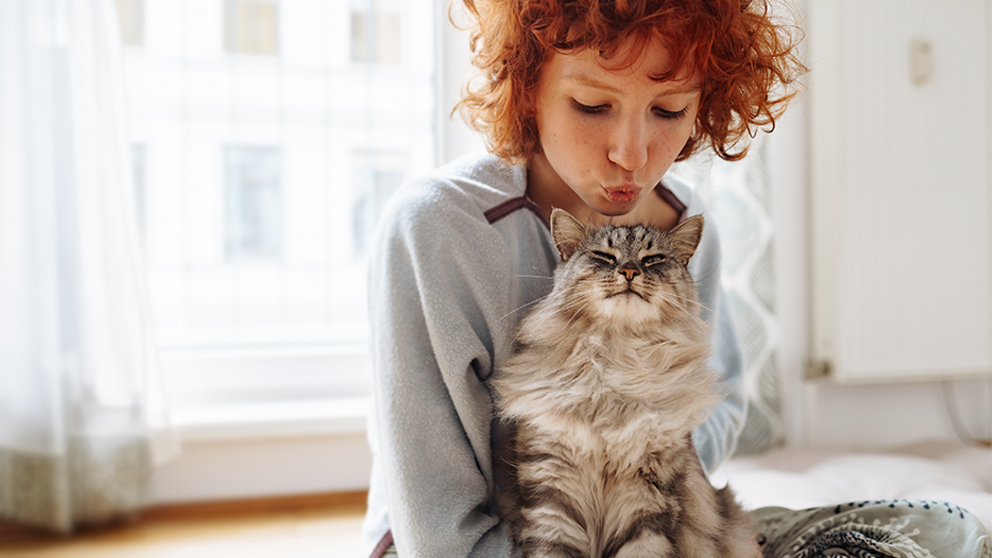 Loving pet owner with cat