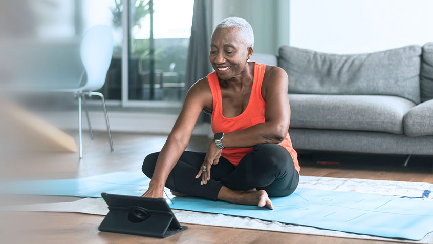 senior woman doing online yoga