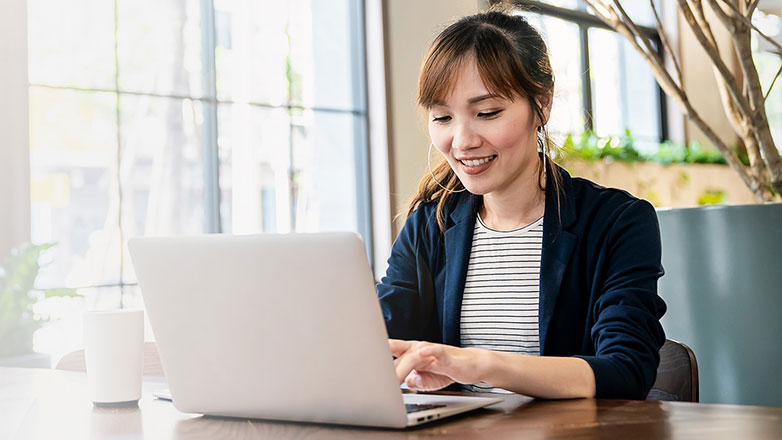 woman working on laptop at desk