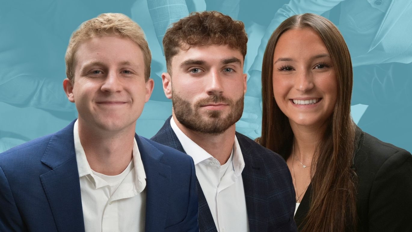 Three individuals in business attire pose side by side in a professional team portrait with a blue background featuring faint workplace imagery.