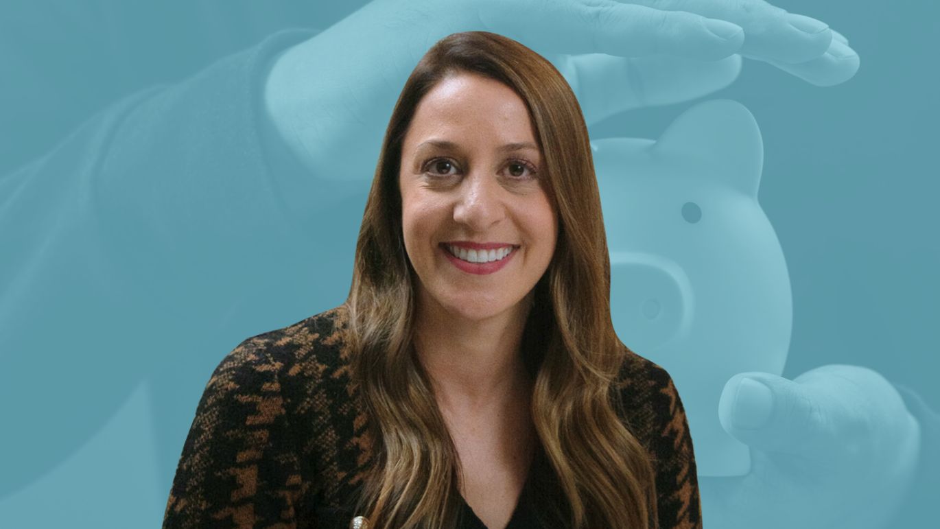 Person posed against a blue-toned background featuring hands protecting a piggy bank.