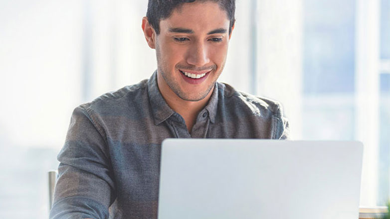 Man is working on his laptop.