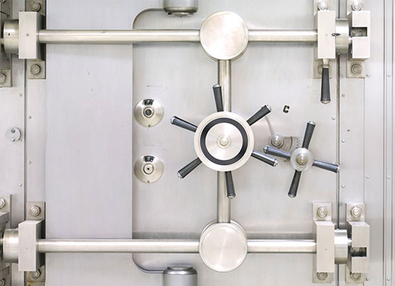 Large vault door with silver finish.